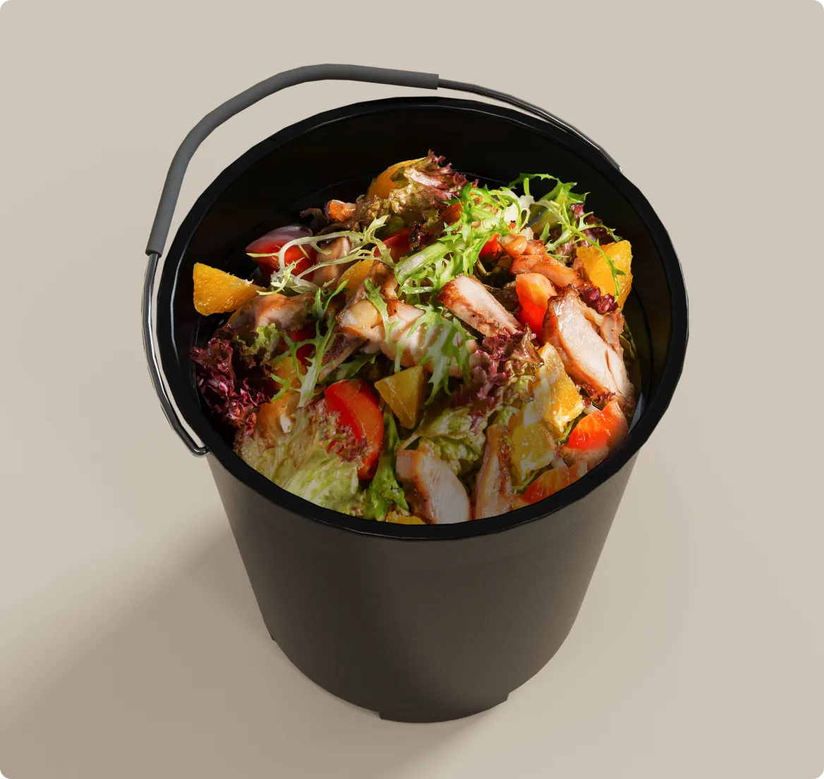 Restos de comida en un cubo – el tipo de residuos que el Dreame SF25 WiFi Triturador de basura reduce hasta un 90% en volumen